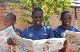 Ugandan Boys Reading Newspapers